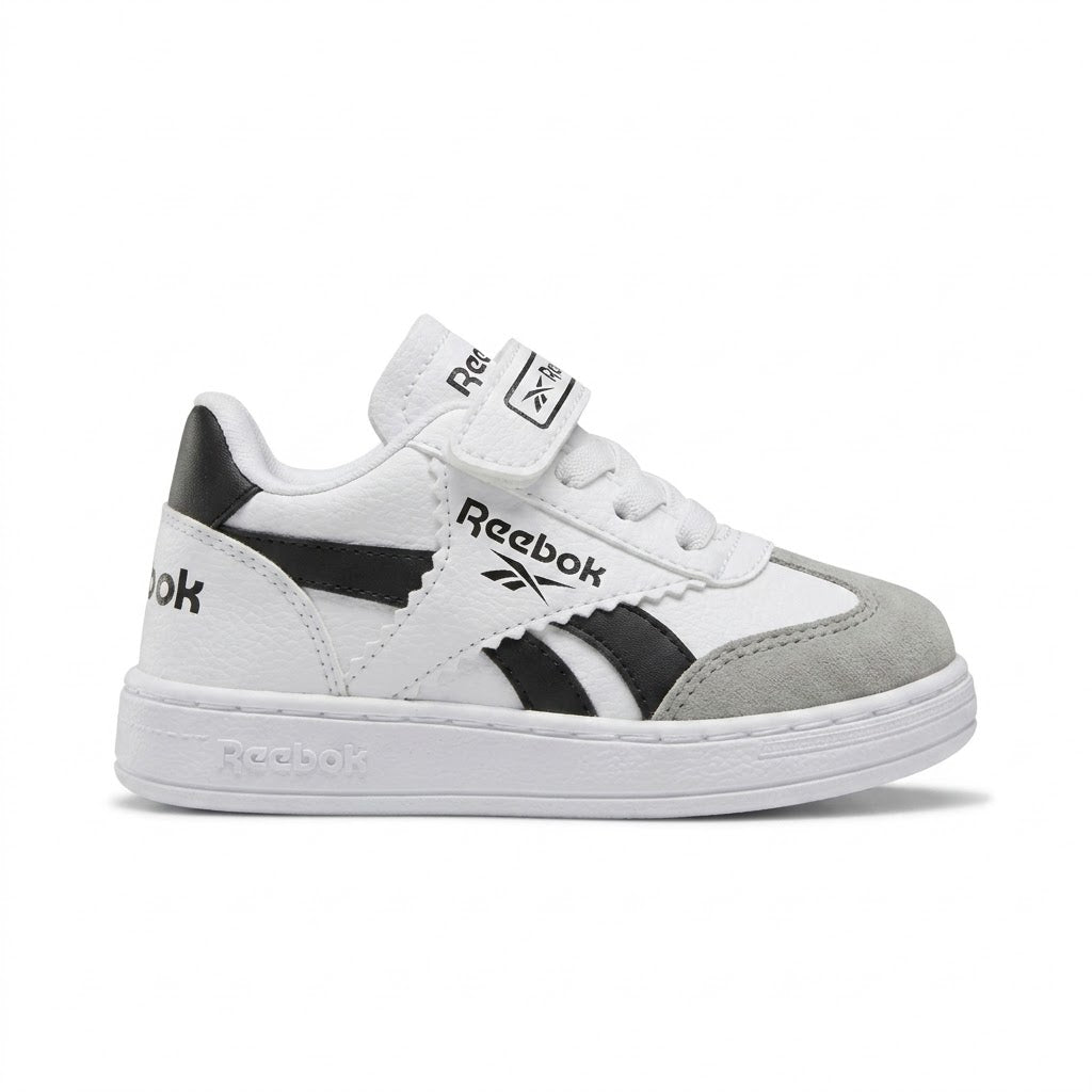 Kids' Classic White Sneaker with Black Accents and Adjustable Strap